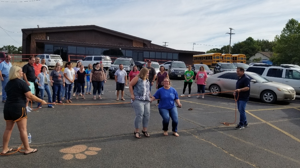 YPS teachers engage in a jump rope, leadership activity. 